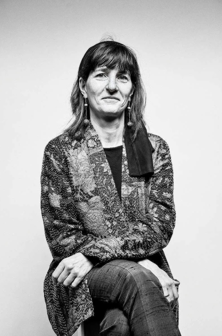 Black-and-white seated portrait of Dr. Michela Marinelli
